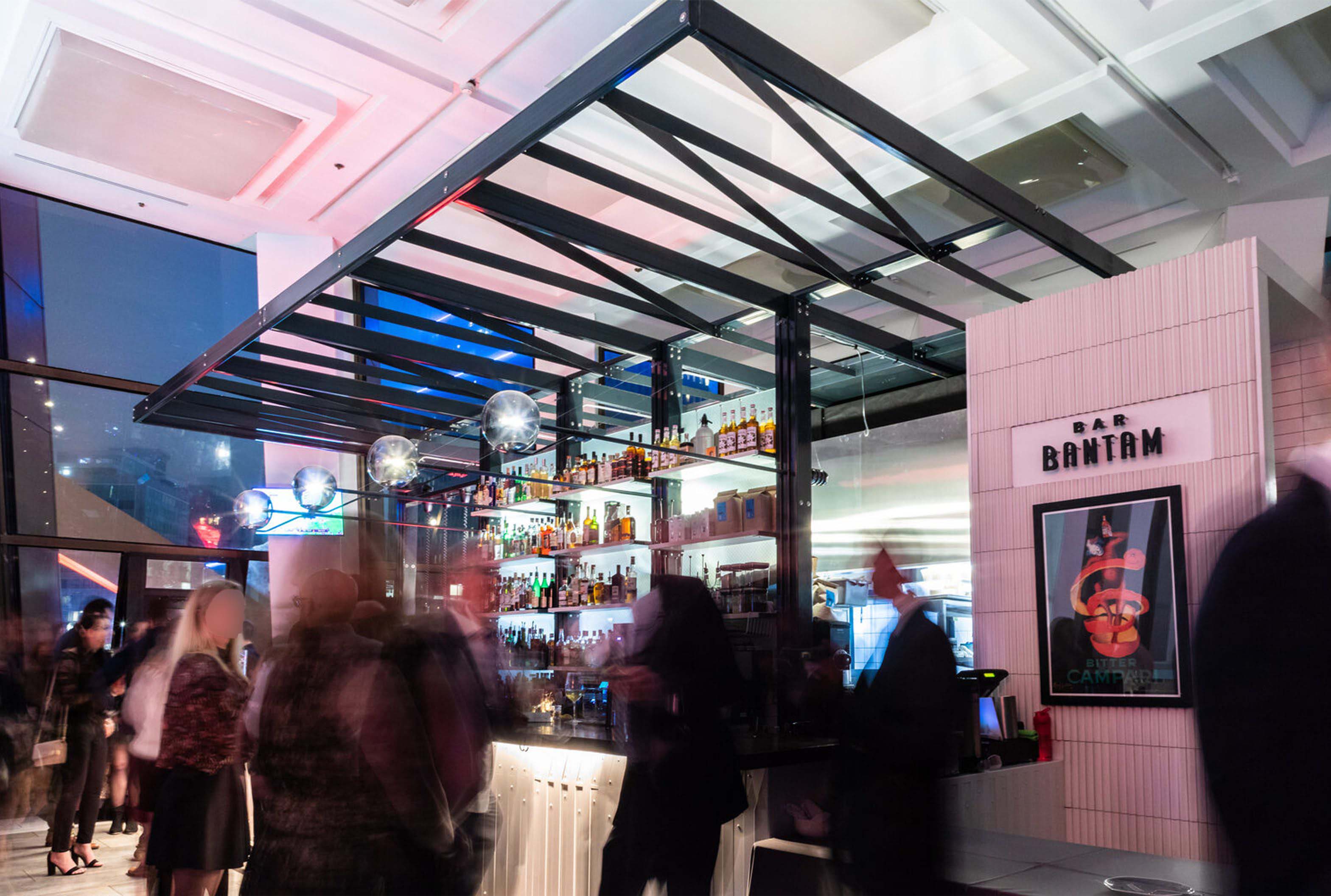 Night time scene of bar bantam, populated with patrons