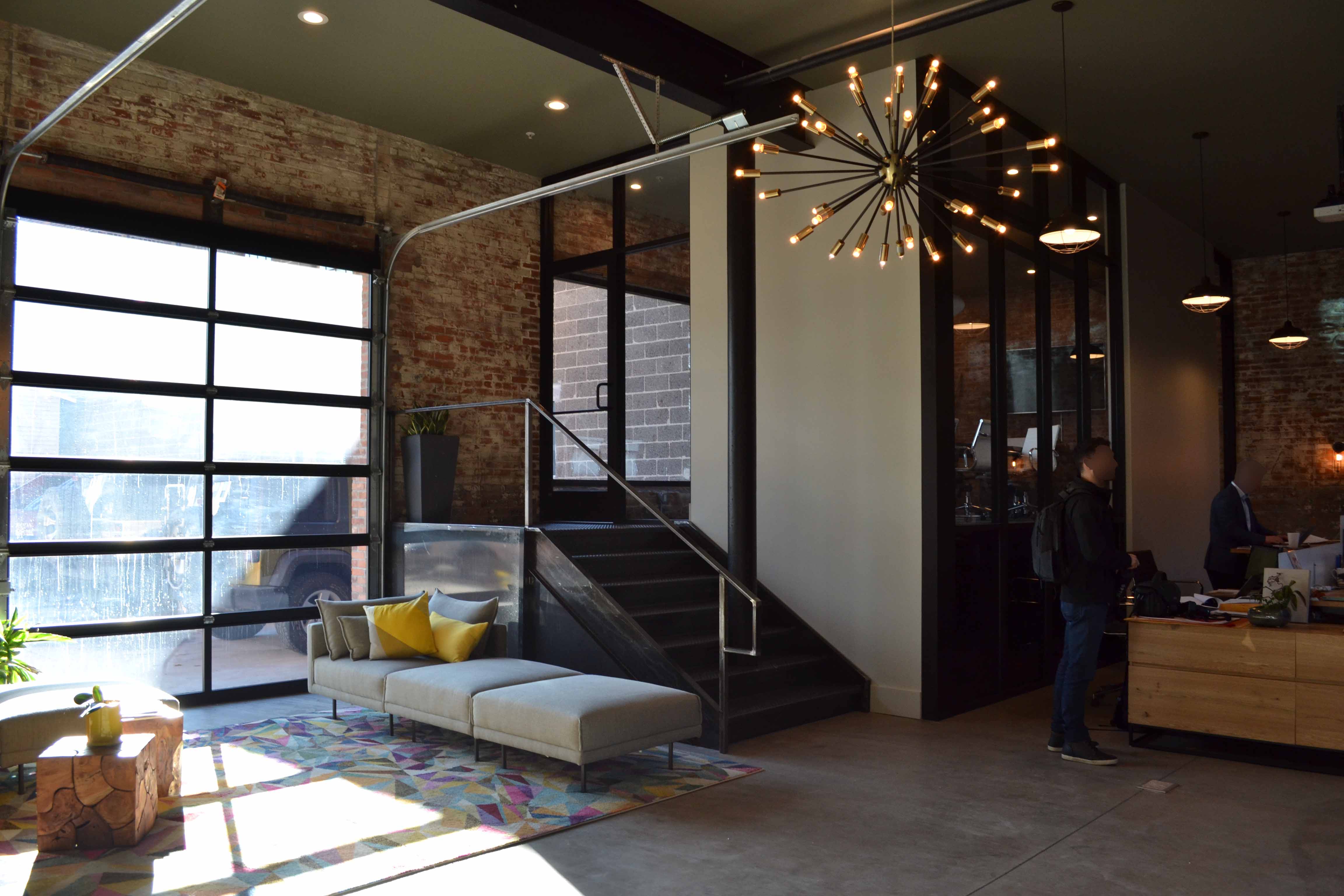 Interior of Truth Collective space, entrance and stairs down to main floor