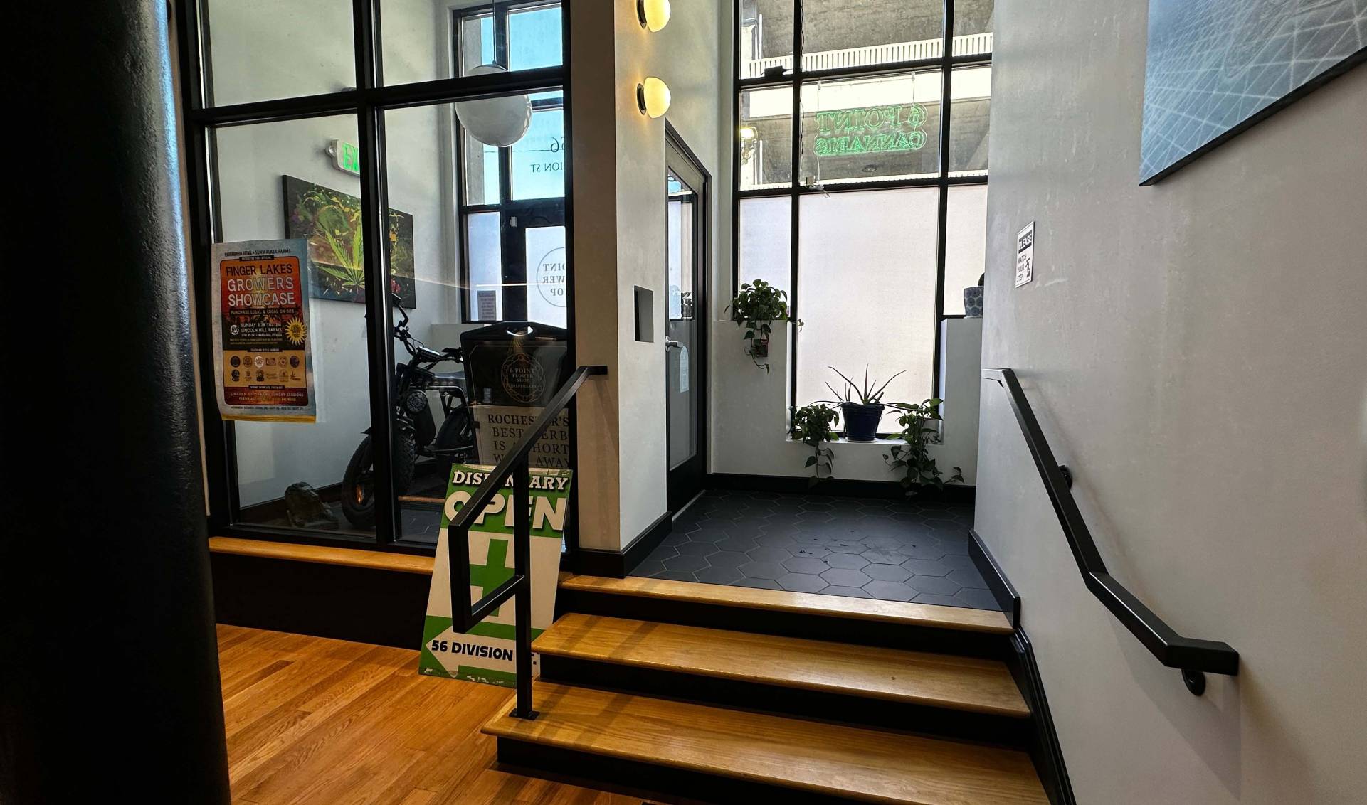 Entrance and stairs leading down to six point dispensary storefront